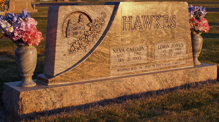 Sunset glow on grave marker for Neva and Lorin Hawkes